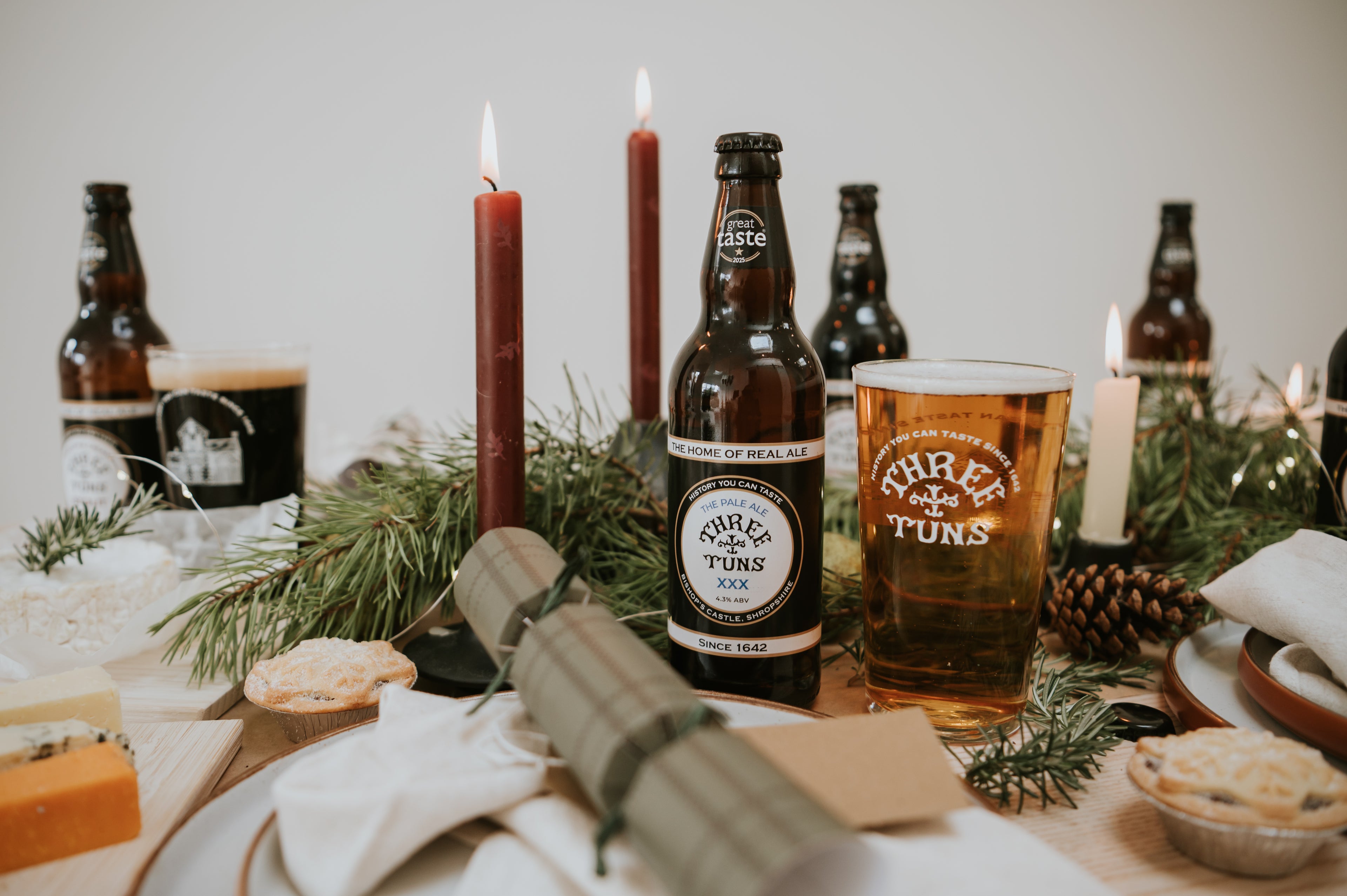 festive table setting with bottles of three tuns brewery award-winning beers 
