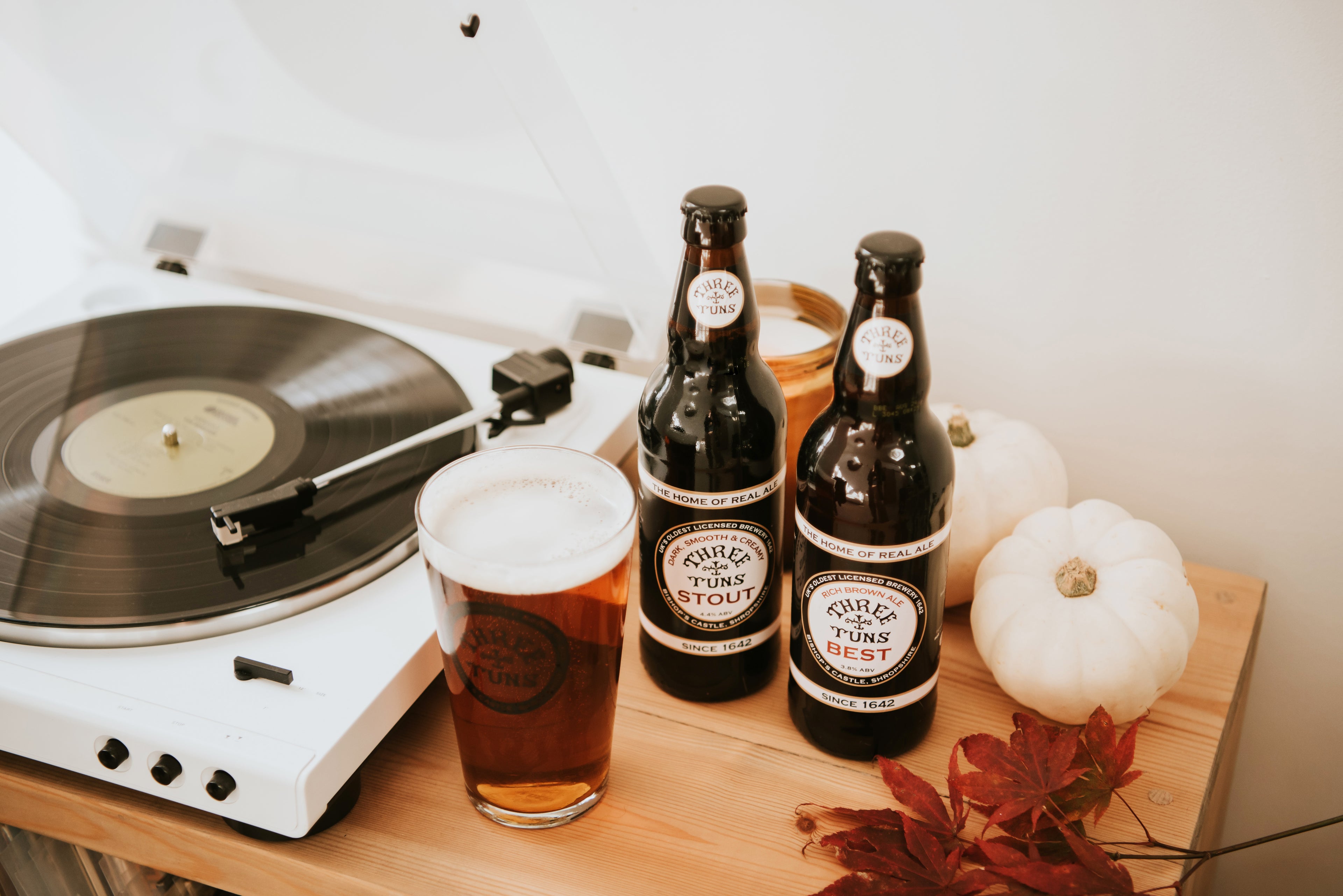 three tuns brewery beer bottles record player pumpkins autumn aesthetic
