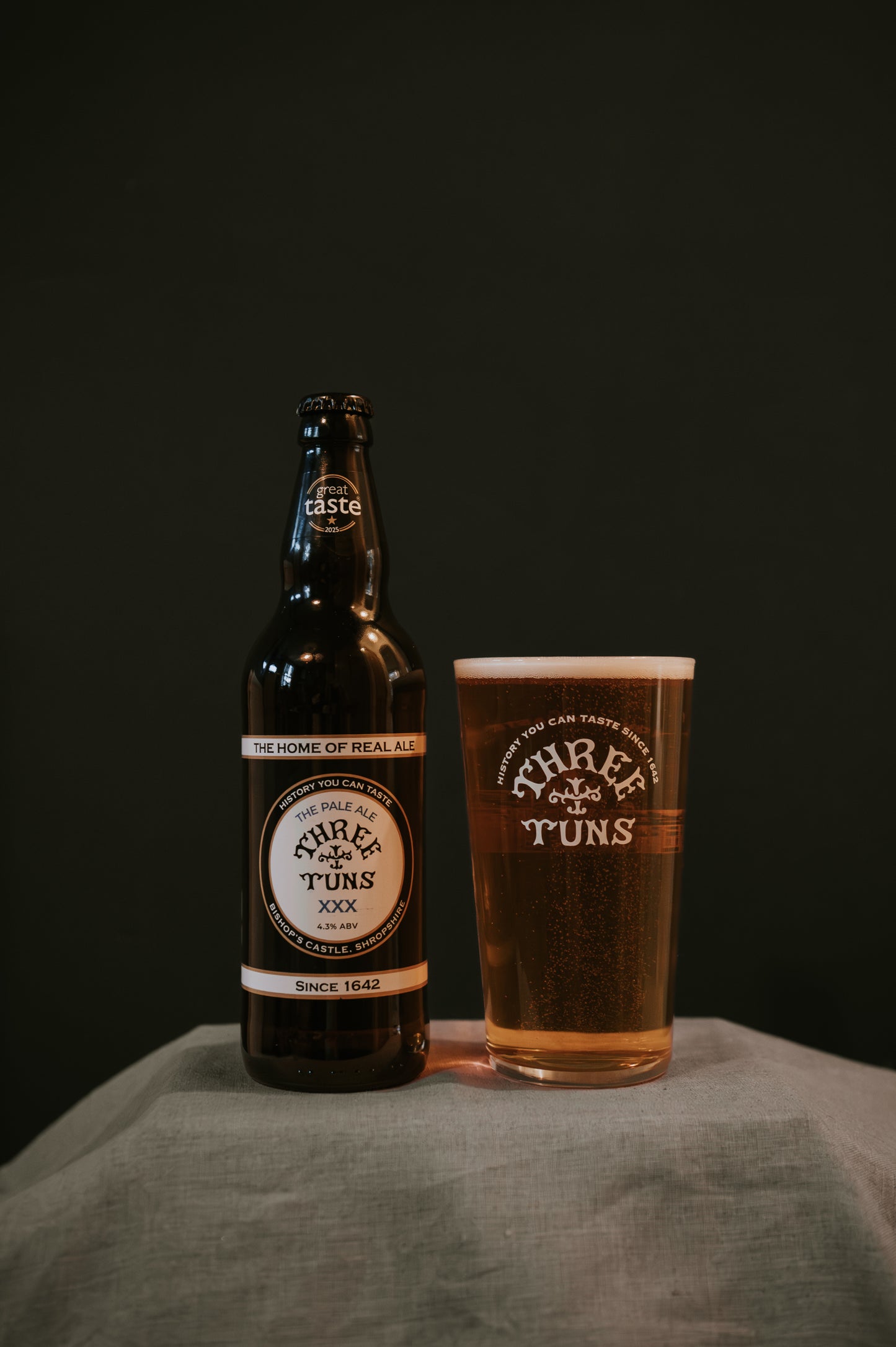 three tuns brewery xxx pale ale beer bottle and pint